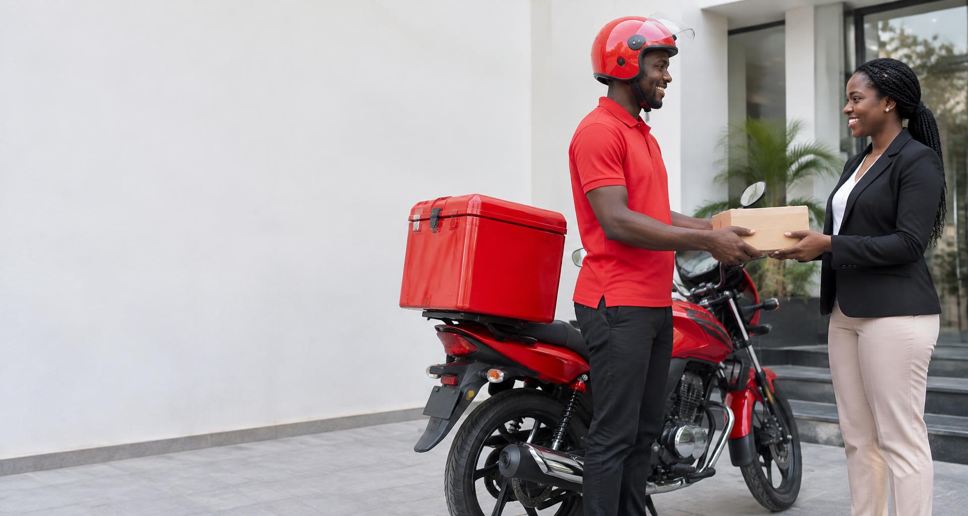 A Ceetify dispatch rider handing a parcel to a business customer